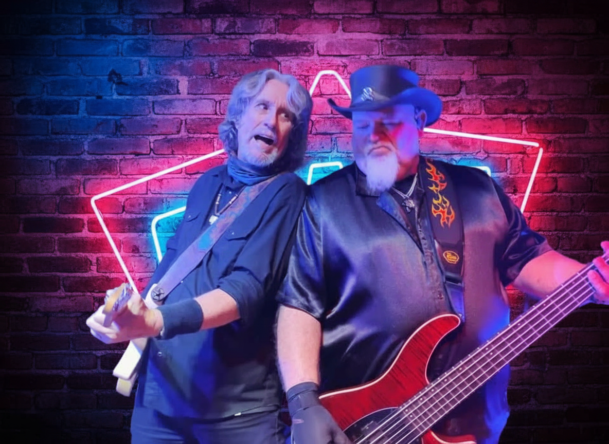 Lead vocalist and bassist performing together on stage