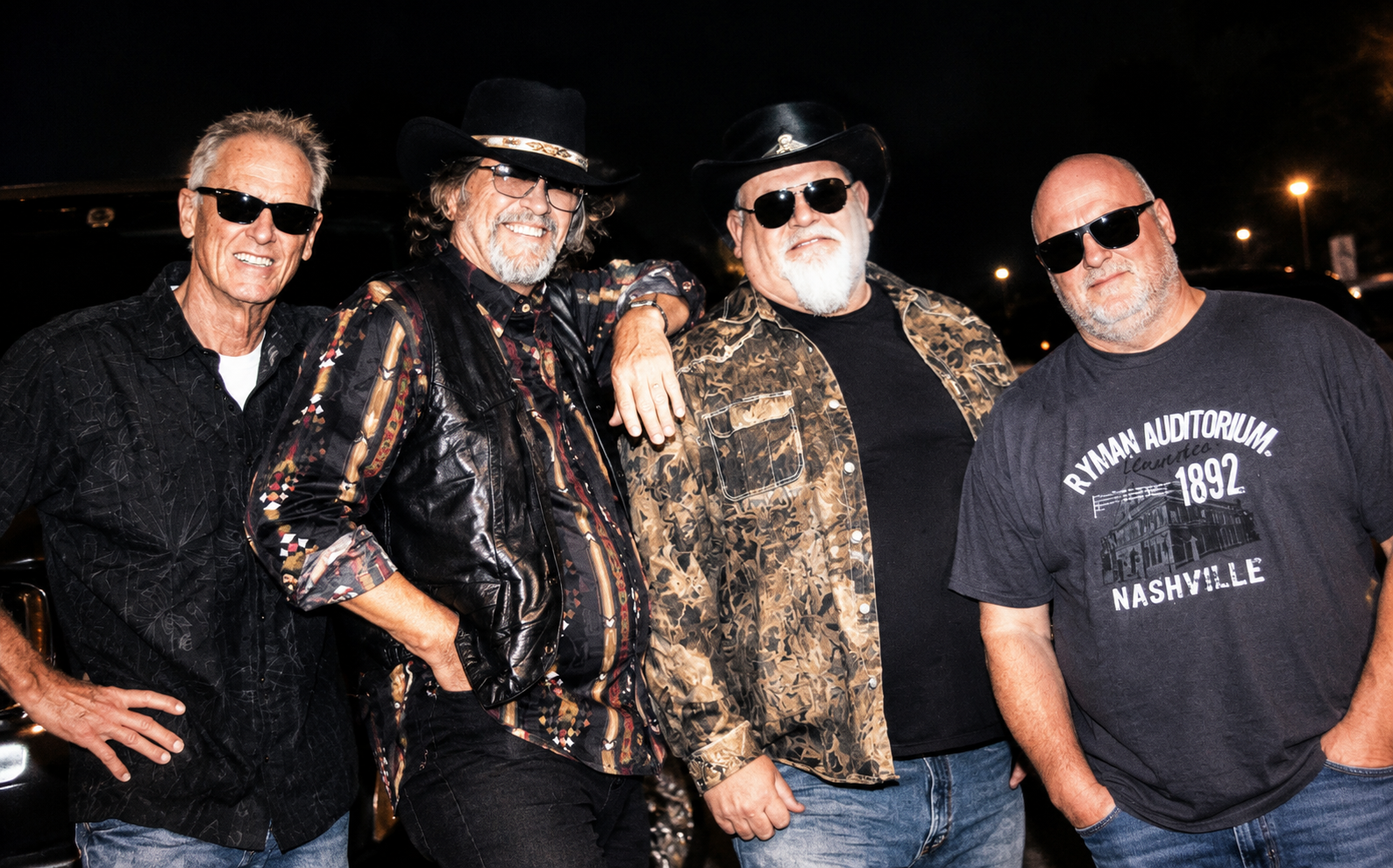 Coyote Creek band photo — all four members at night